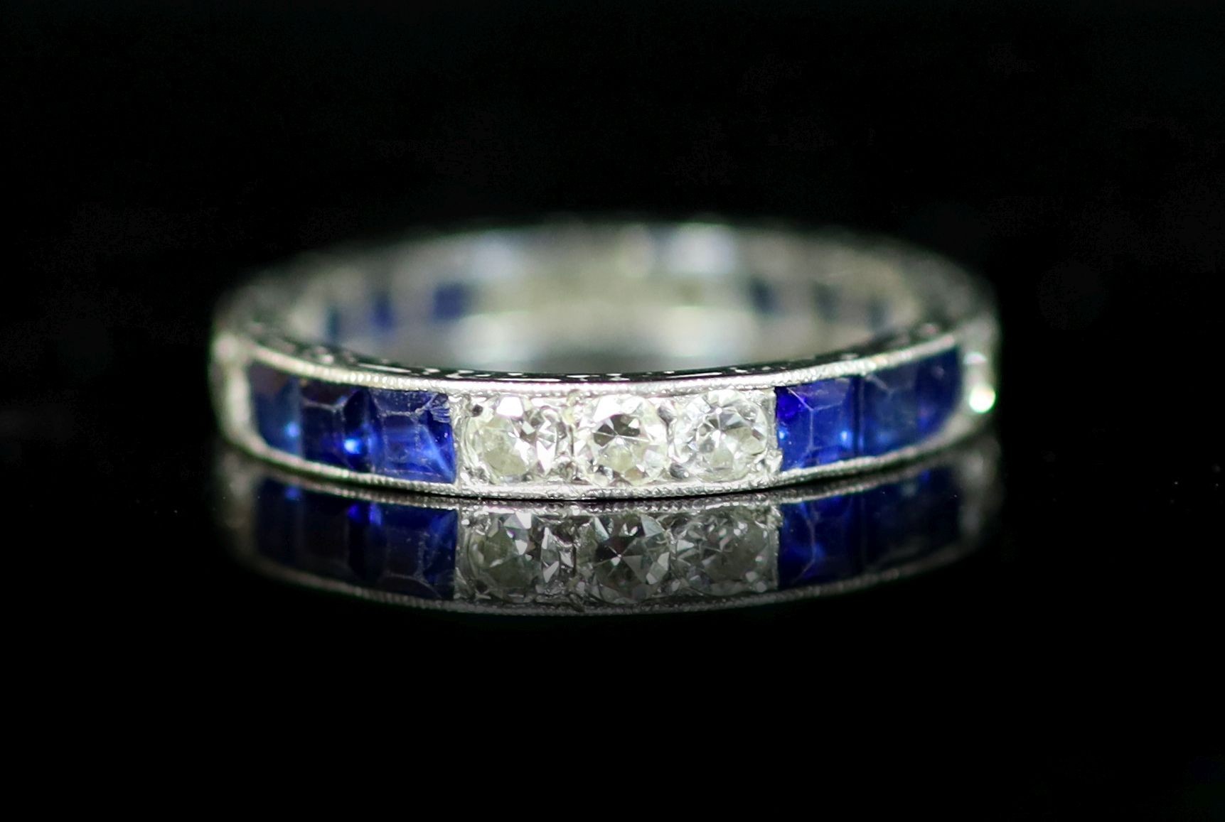 A platinum, sapphire and diamond set full eternity ring